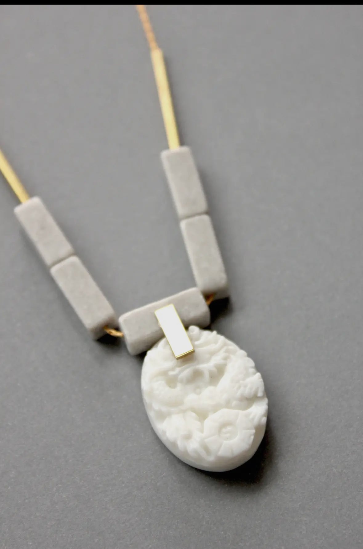 Carved white jade pendant