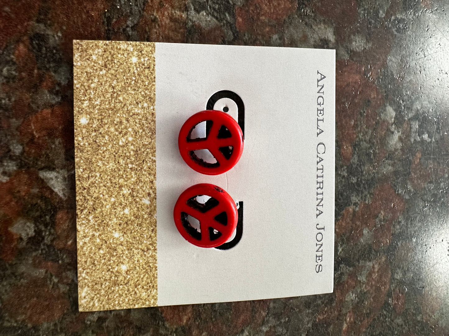 Red peace sign studs